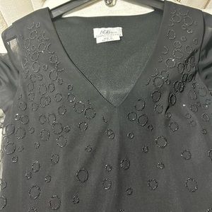 Very comfortable but elegant black dress, long with short sleeves size 10